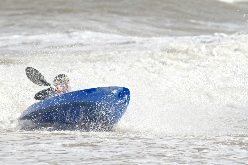 Blue Tootega Pulse 85 being surfed by person on sea