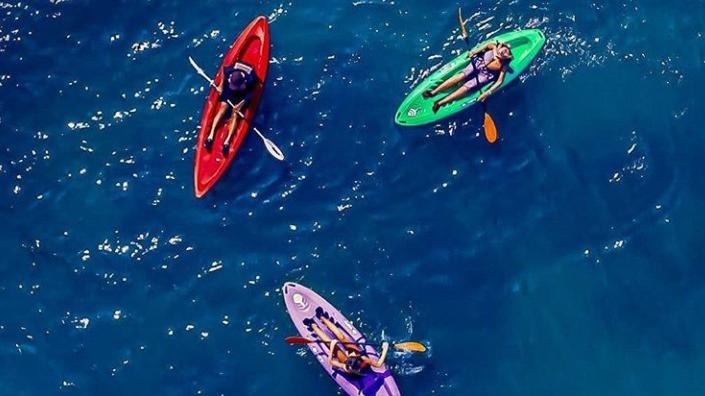 3 tootega pulse 85s on the water with people paddling them