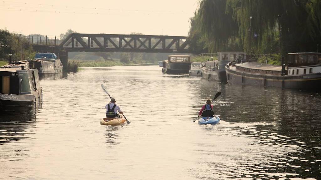 2 people paddling on flat water on tootega pulse 85s